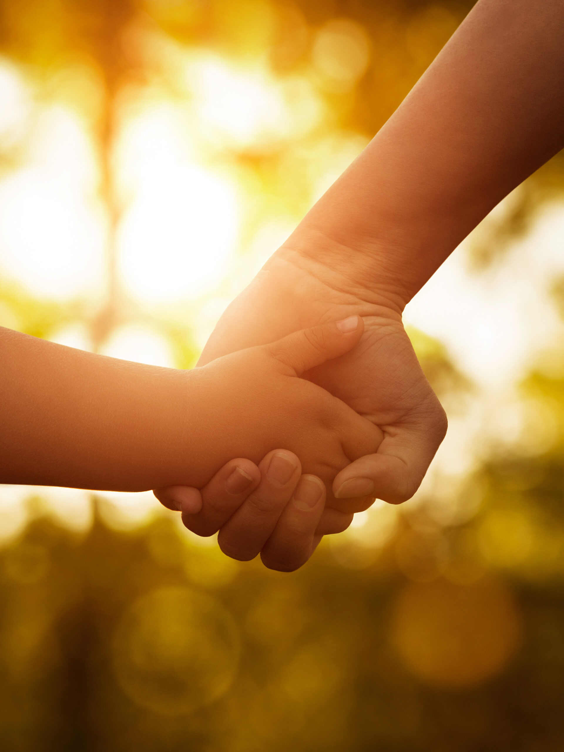 Parent and child holding hands