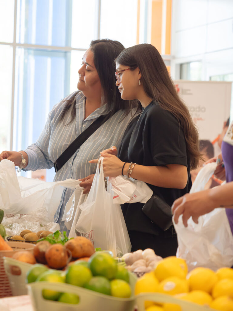 Mother and Daughter Picking out Healthy Groceries