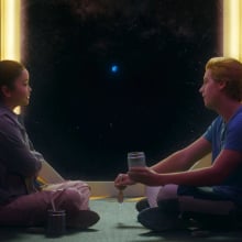 Lana Condor and Cole Sprouse share longing looks on a spaceship in "Moonshot"