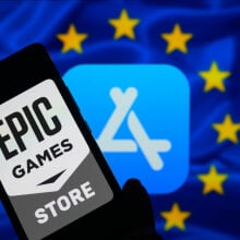 Epic Games Store logo on phone screen in front of Apple App Store logo