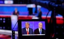 A monitor shows a camera view of the two presidential candidates during the July debate.