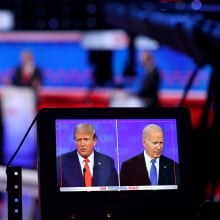 A monitor shows a camera view of the two presidential candidates during the July debate.