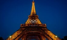 This photograph shows the Olympic rings on the Eiffel Tower