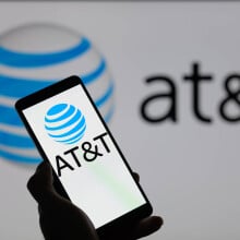 att logo on phone in front of att logo