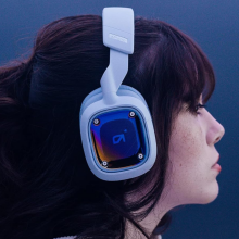 Girl wearing white logitech gaming headset 