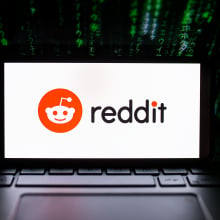 a computer with a Reddit Logo