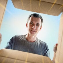 Man looking into a cardboard box