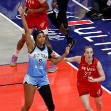 Chicago Sky forward Angel Reese is guarded by Indiana Fever guard Caitlin Clark