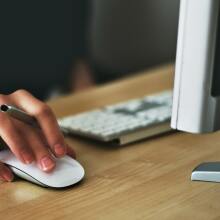 A person uses a laptop computer.