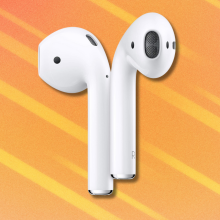 Apple AirPods on orange and white abstract background