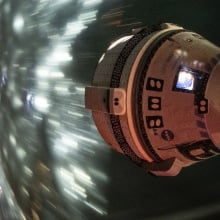 Boeing Starliner whizzing over Earth while docked at the International Space Station