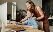 Mother and child using PC