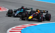 Max Verstappen of the Netherlands driving the Oracle Red Bull Racing RB20 overtakes George Russell