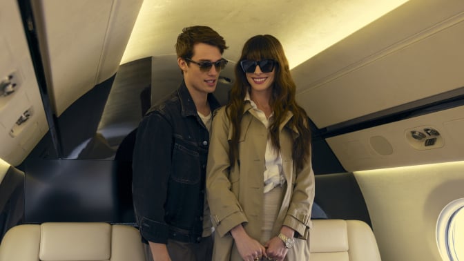 Hayes Campbell (Nicholas Galitzine) and Solene (Anne Hathaway) boarding a private jet in "The Idea of You."