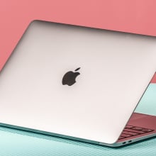 MacBook Air on pink and green background