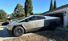 tesla cybertruck in a driveway