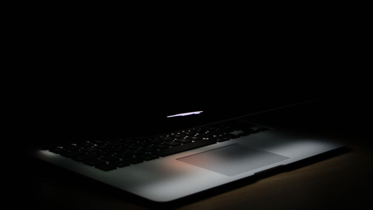 Laptop in dark room