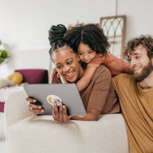 A family looking at a device