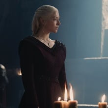 Rhaenyra Targaryen wearing a red gown.