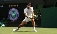 Carlos Alcaraz of Spain plays a backhand