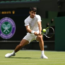 Carlos Alcaraz of Spain plays a backhand