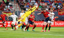 Gianluigi Donnarumma of Italy, Aymeric Laporte of Spain and Francesco Acerbi of Italy battle for the ball