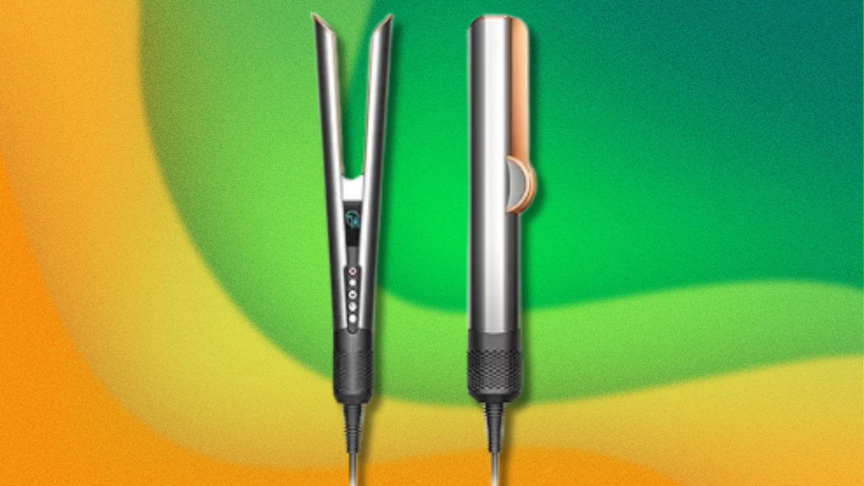 Dyson Airstrait hair straightener on green and yellow background