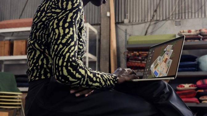 person working on m3 macbook air on their lap