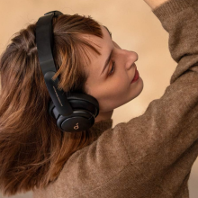 woman wearing soundcore by anker headphones