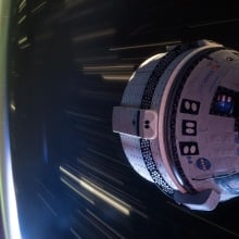 Boeing Starliner flying over Earth while docket at ISS