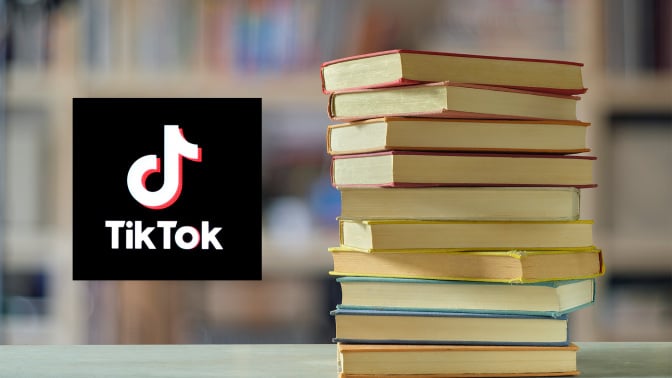 Stack of books next to the TikTok logo. 