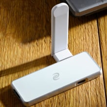 Silver VPN device with white wifi adapter