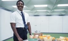 A man (Tramell Tillman as Mr. Milchick in "Severance") rolling a card of honeydew and cantaloupe melon.