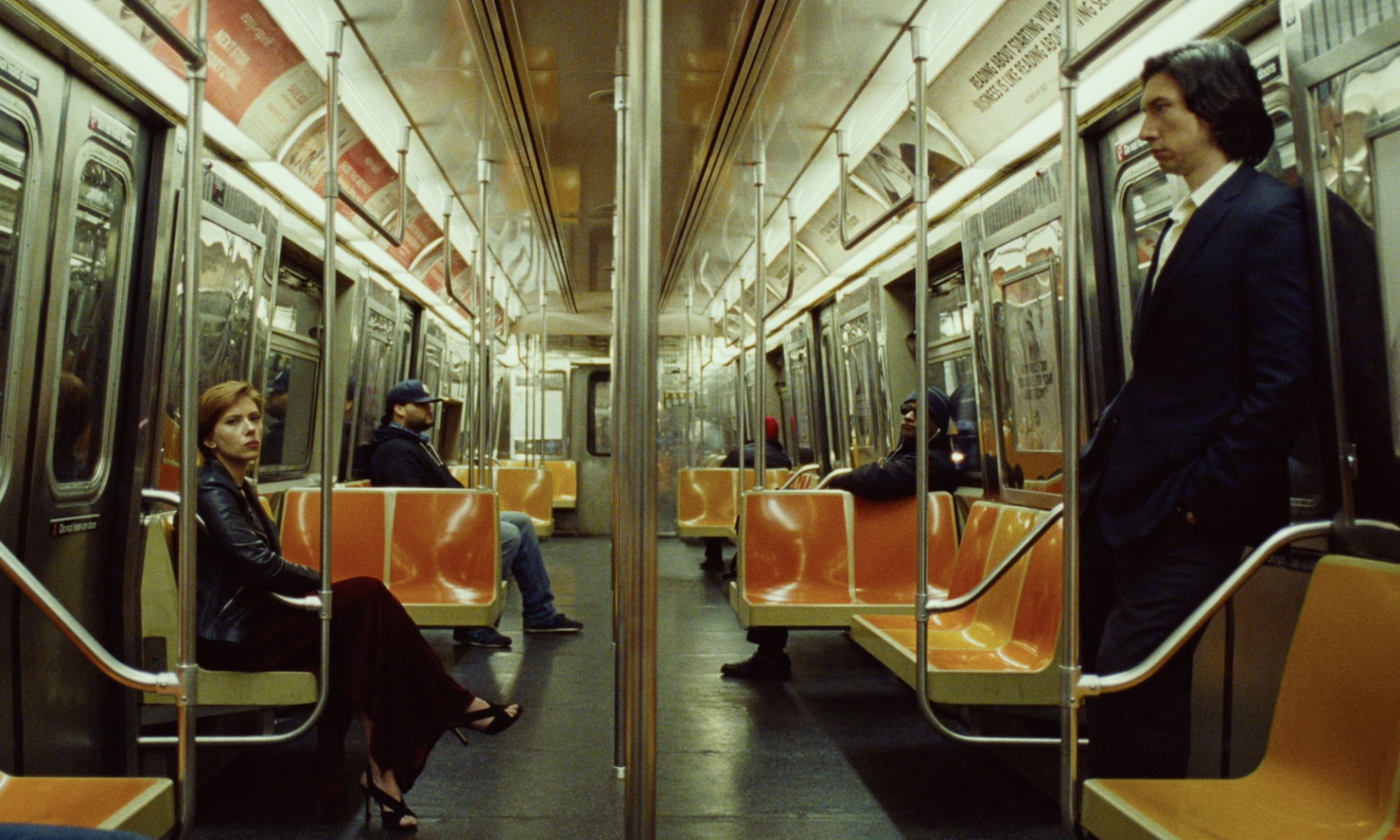 A man and woman at opposite ends of a New York City subway car; still from "Marriage Story."