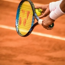 A tennis player about to serve