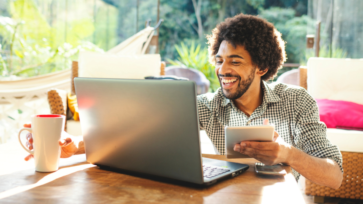 Young man using laptop in the living room