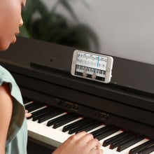 young woman learning piano