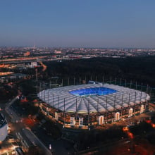 Aerial night view over the illuminated Volksparkstadion