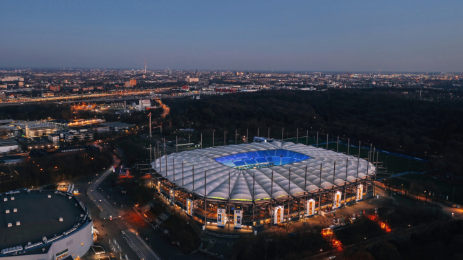 Aerial night view over the illuminated Volksparkstadion