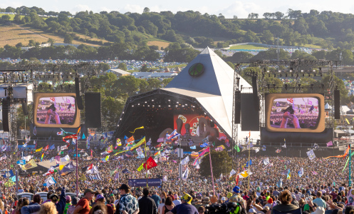 The crowd gathers to watch Elton John perform