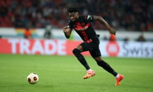 Edmond Tapsoba of Bayer Leverkusen runs with a ball