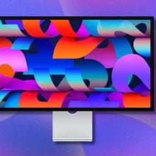 apple studio display with purple background