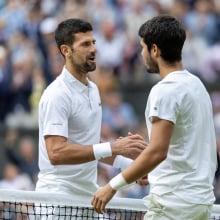 Djokovic and Alcaraz shake hands across the net