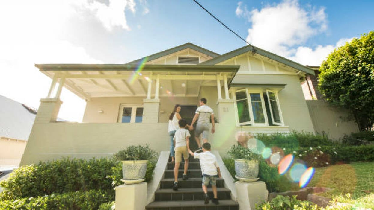 Family walking into their home