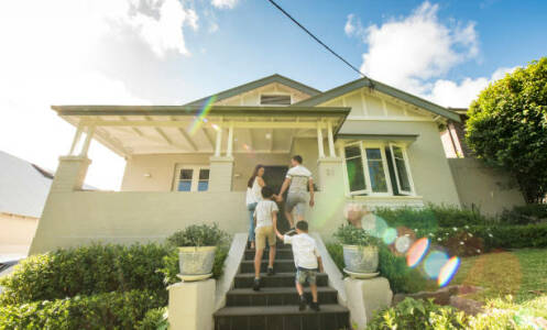 Family walking into their home