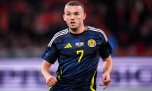 John McGinn of Scotland looks on