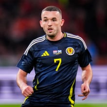 John McGinn of Scotland looks on