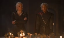 Rhaenyra and Baela Targaryen stand at the head of a war table covered in candles.