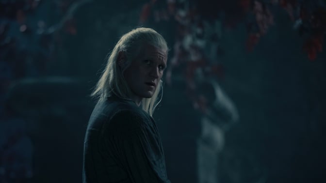 Daemon Targaryen stands beneath a weirwood tree at night.