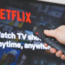 Netflix on a TV screen and remote